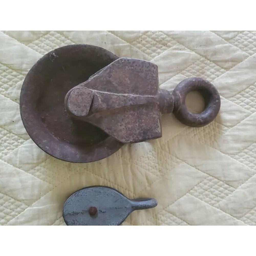 Pair of vintage metal pullies